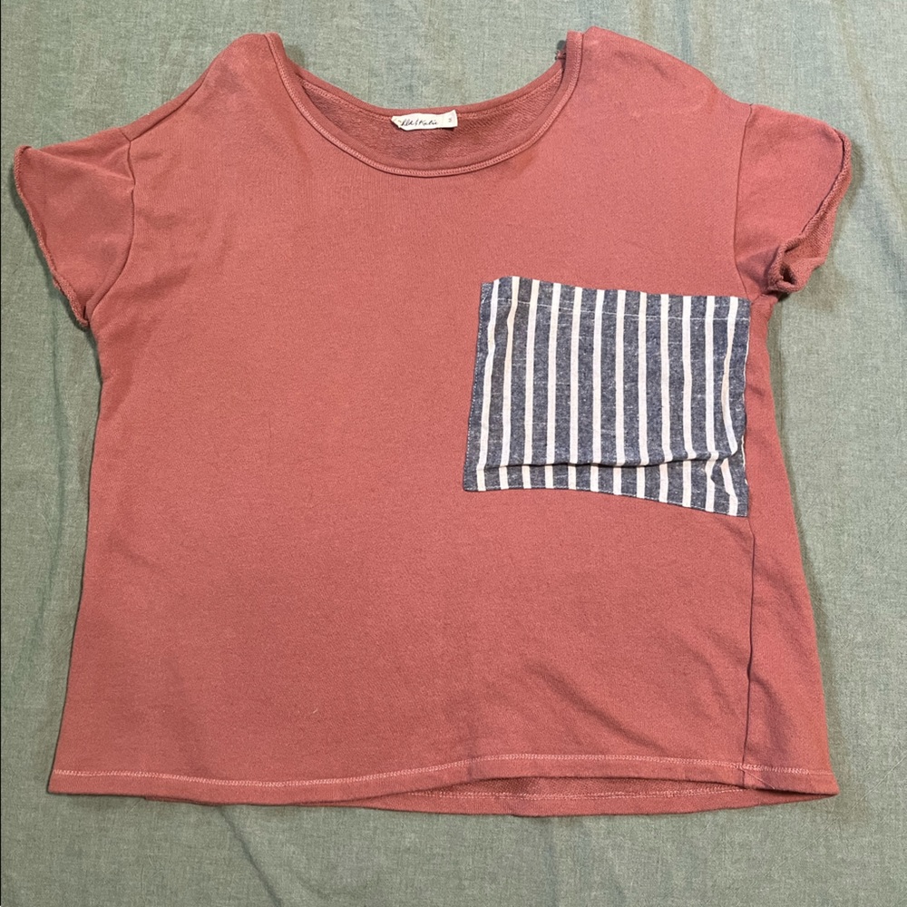 Pink womens shirt with oversized white and blue stripped pocket